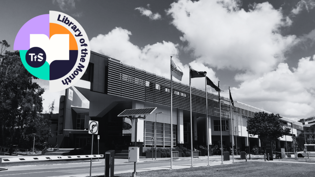 Black and white photo of outside of a library with Library of the Month logo